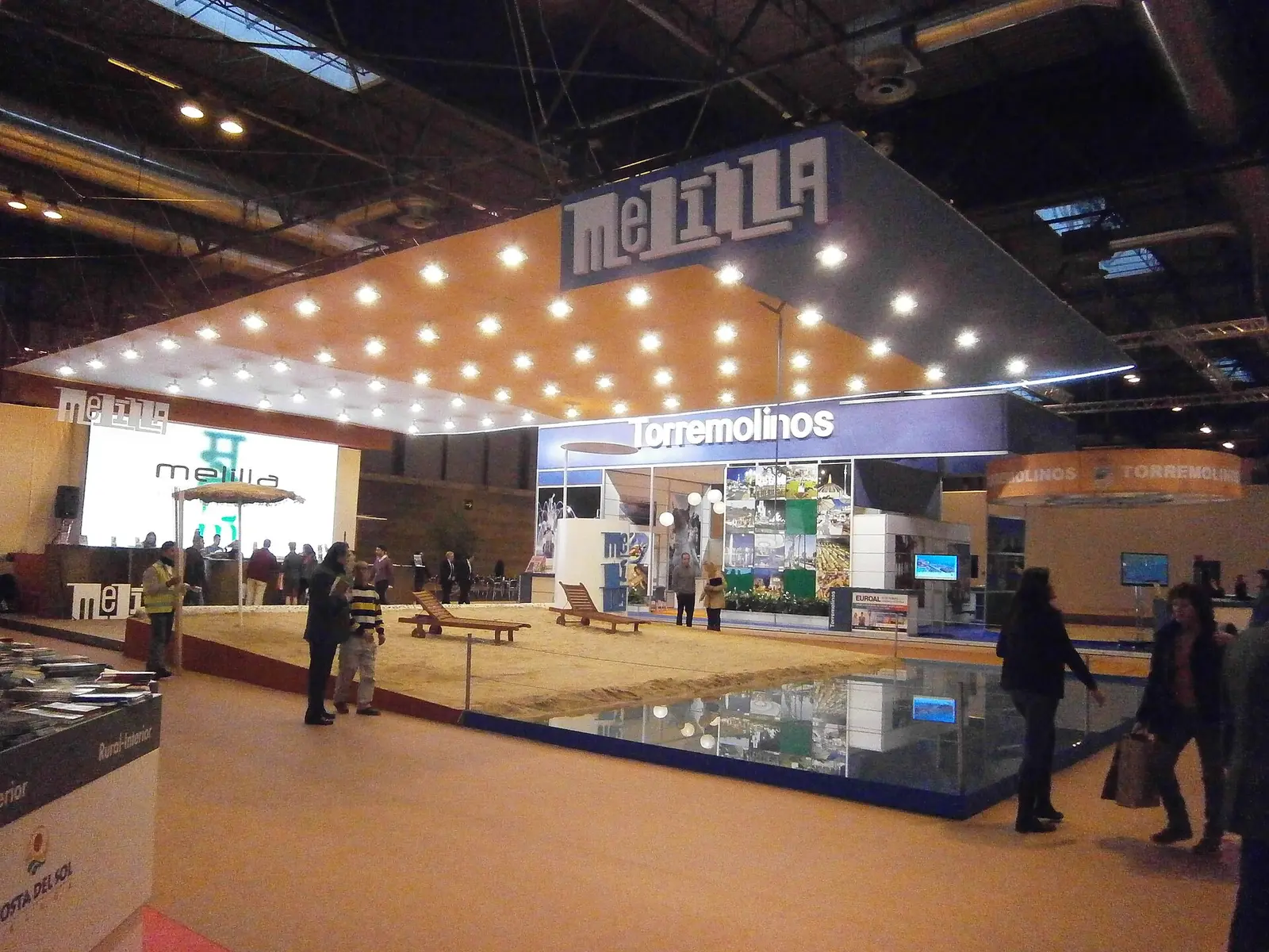 Regional tourism stand with a sand display inside a hall at FITUR 2012