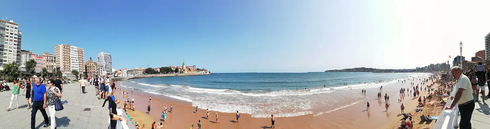 San Lorenzo beach in Gijon with the old town on the headland