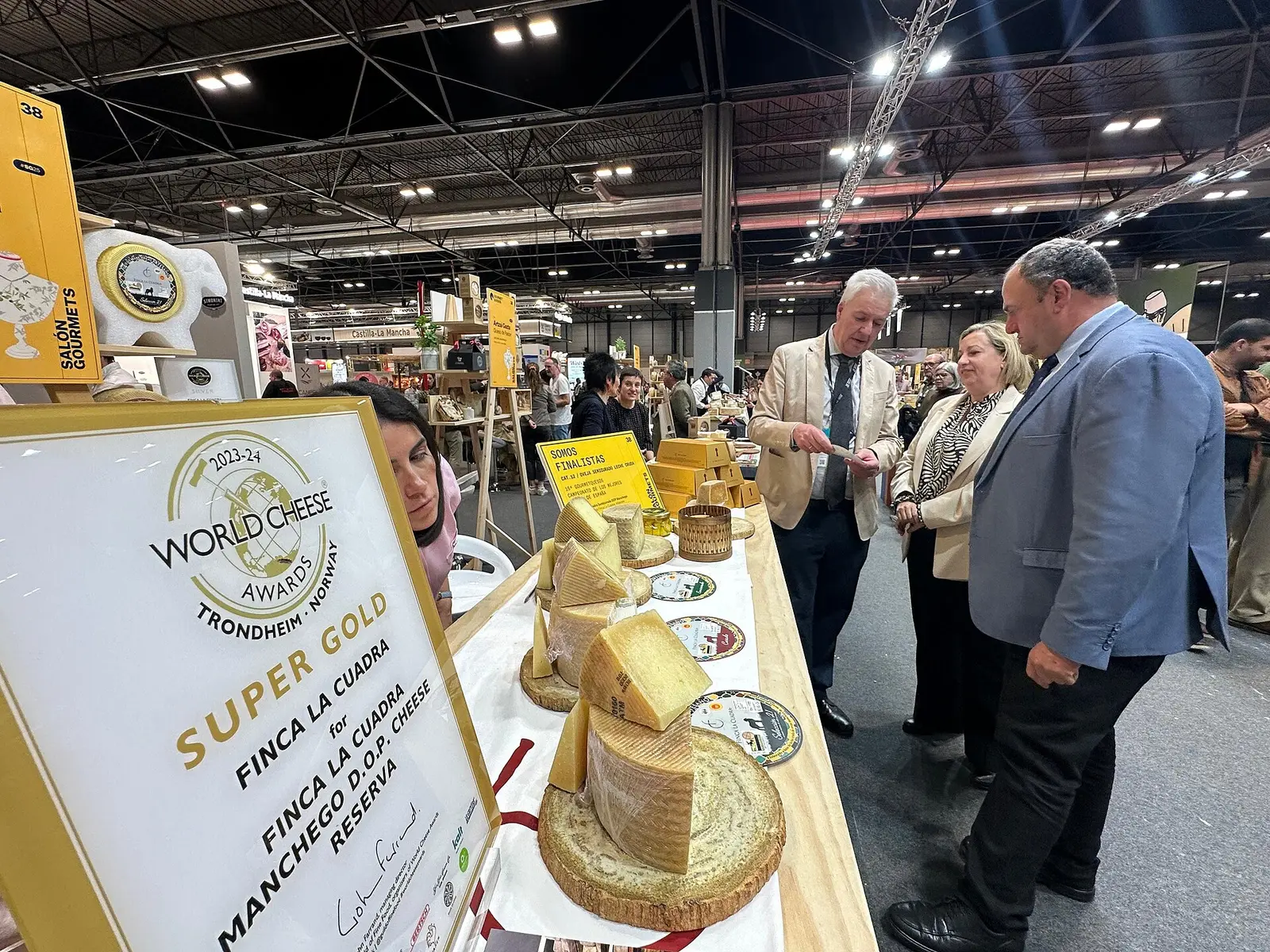 Visitors at a cheese stand during the 38th Salon Gourmets in Madrid