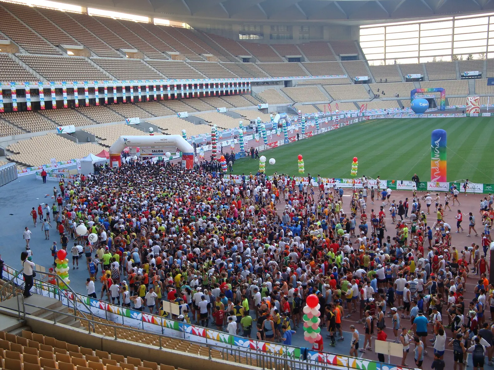 Runners gathered on the track of the stadium at the start of the Seville marathon in 2009