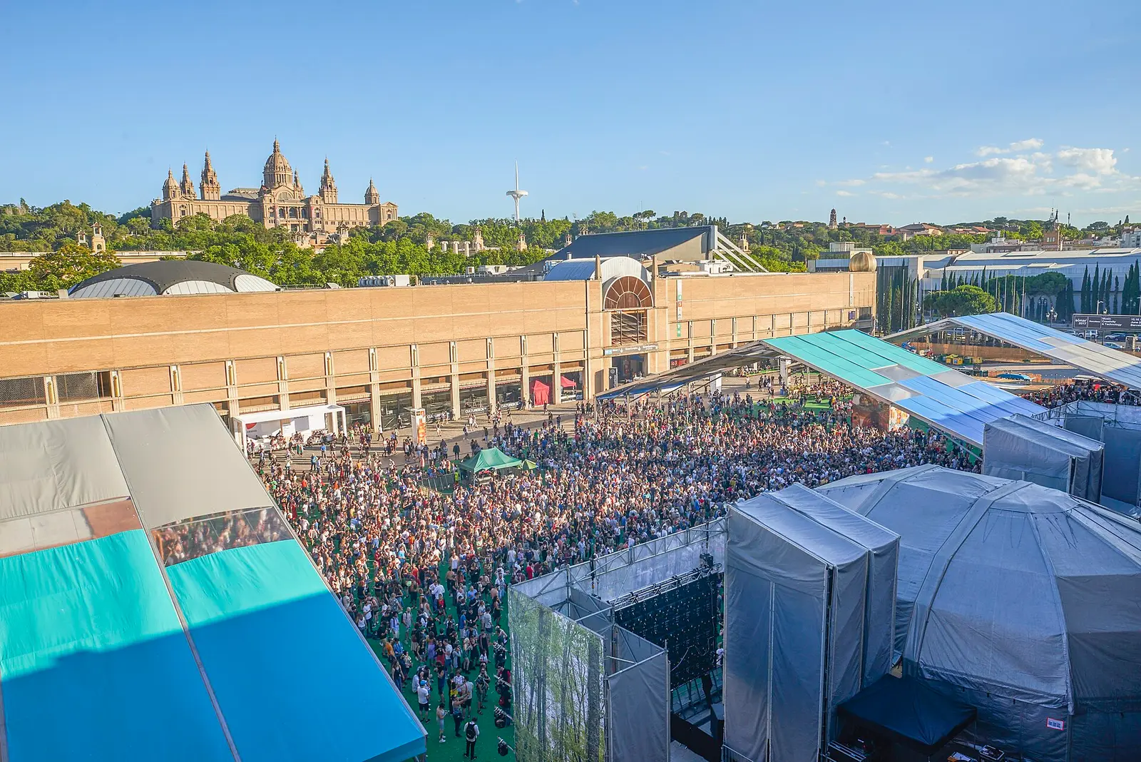 Crowd at the Sonar by Day festival with the Palau Nacional on Montjuic behind